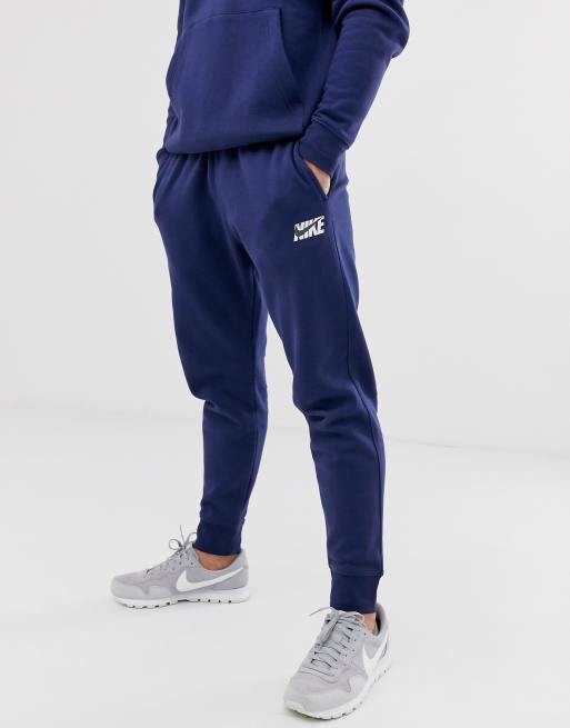 Blue nike 2024 swoosh tracksuit