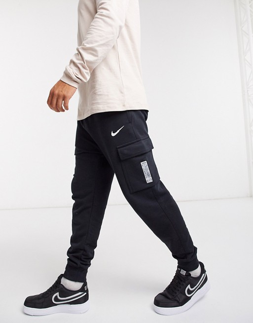 Nike Swoosh On Tour Pack cuffed cargo joggers in black