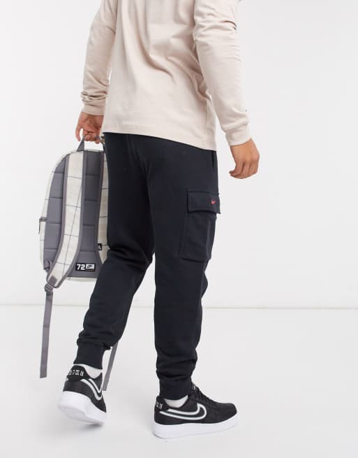 Nike Swoosh On Tour Pack cuffed cargo joggers in black ASOS