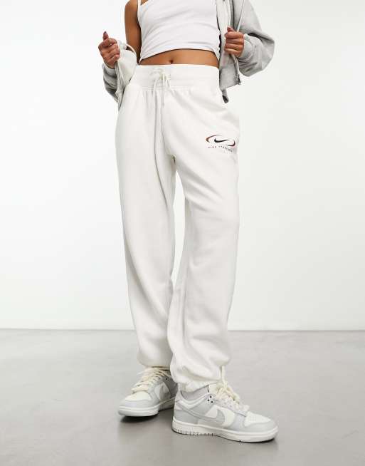 Nike mini swoosh high rise wide leg joggers in grey and sail