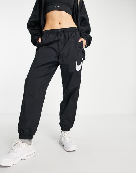 Nike swoosh oversized joggers in black - view 1