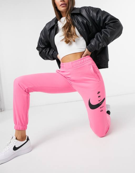 Pink nike swoosh joggers new arrivals