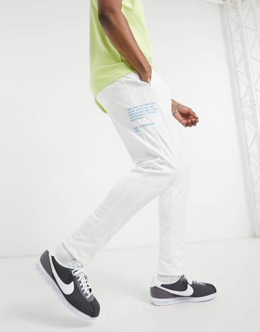 Nike Swoosh Pack polyknit cuffed joggers in white