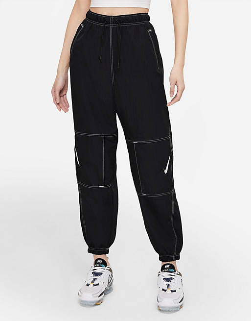 Nike Swoosh Pack Repel woven cuffed pants in black | ASOS