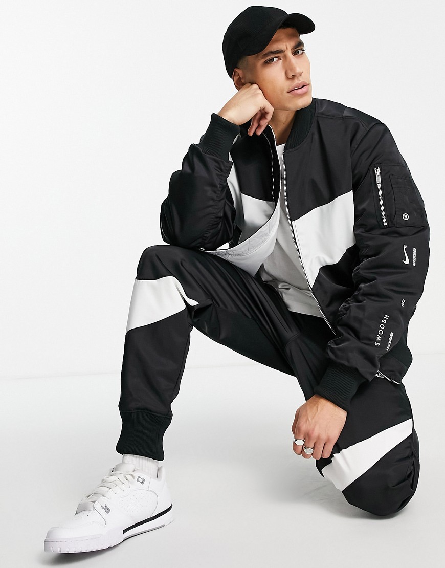 Nike Swoosh Pack synthetic-fill reversible bomber jacket in black