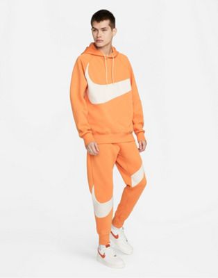Nike Swoosh Pack Tech Fleece cuffed sweatpants in orange - Click1Get2 On Sale