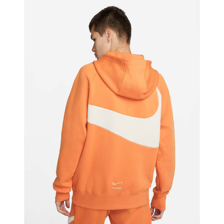 orange nike tech tracksuit