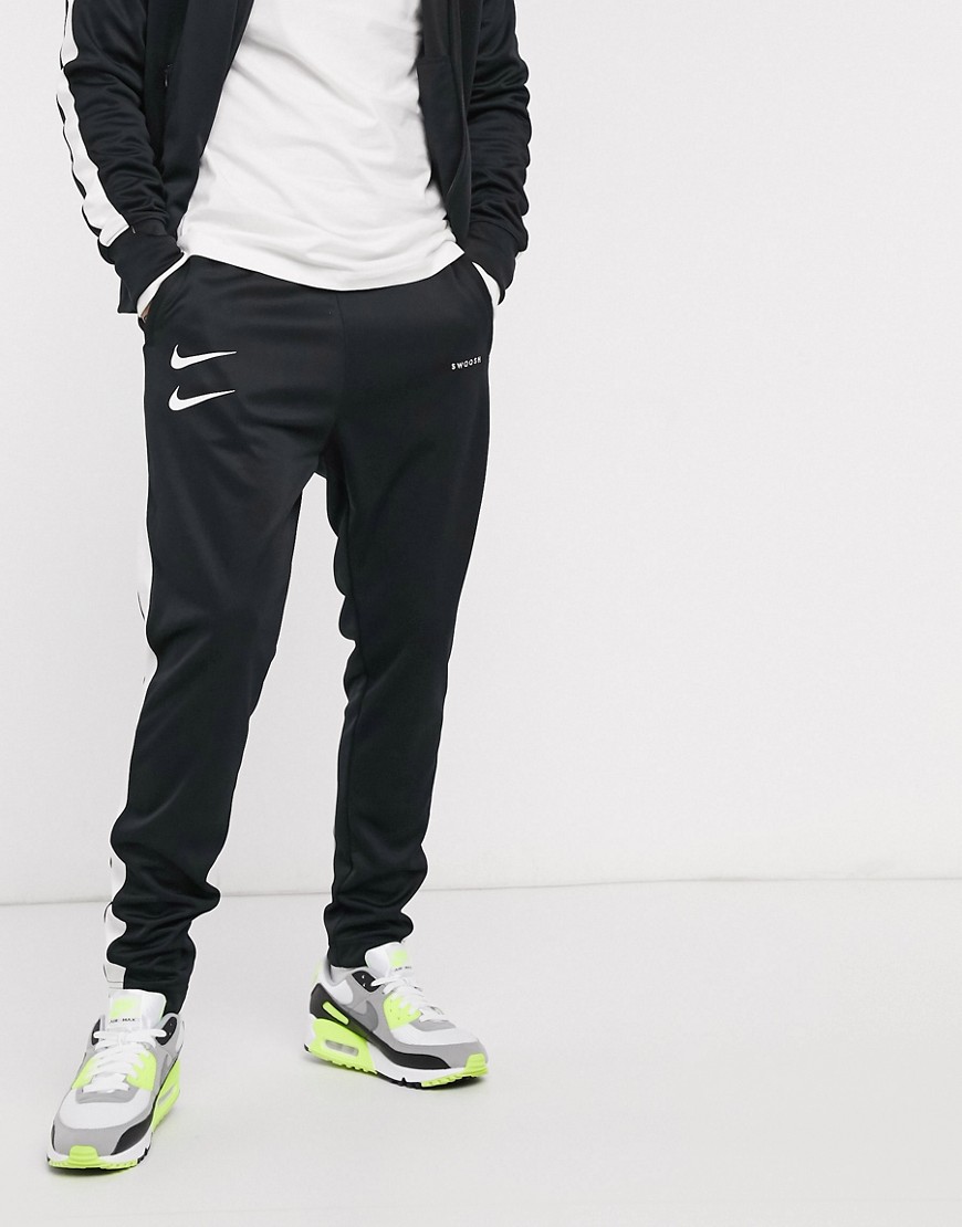 Nike Swoosh polyknit joggers in black