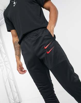 Nike Swoosh polyknit joggers in black 