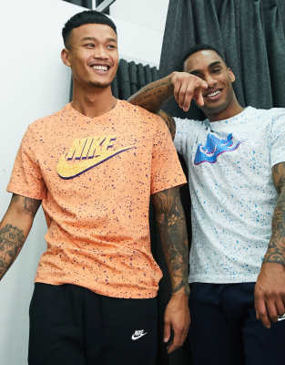 white nike shirt with orange swoosh