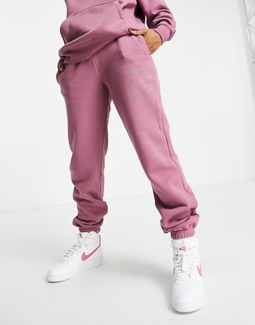 Nike Swoosh rhinestone applique washed cuffed sweatpants in pink | ASOS