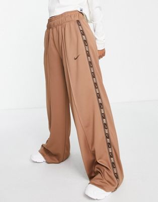 Nike swoosh tape wide leg joggers in archaeo brown - ASOS Price Checker