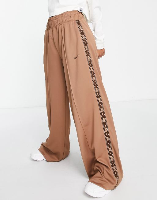 Nike swoosh tape wide leg joggers in archaeo brown