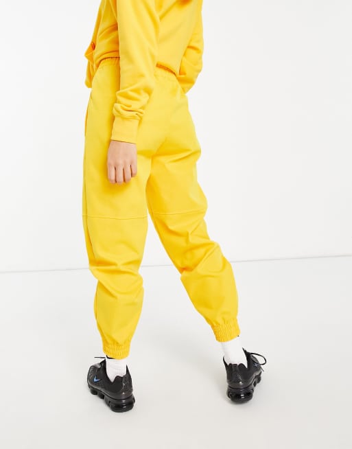 nike yellow tracksuit bottoms
