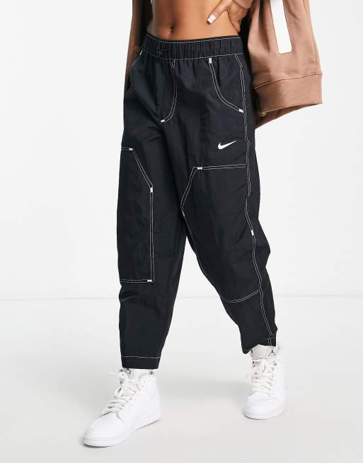 Nike Swoosh woven high-waisted panelled pants in black | ASOS