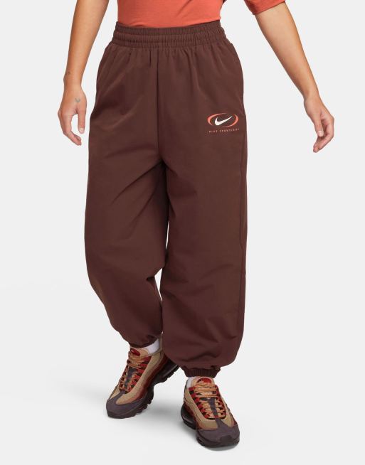 Nike Swoosh woven parachute sweatpants in earth brown