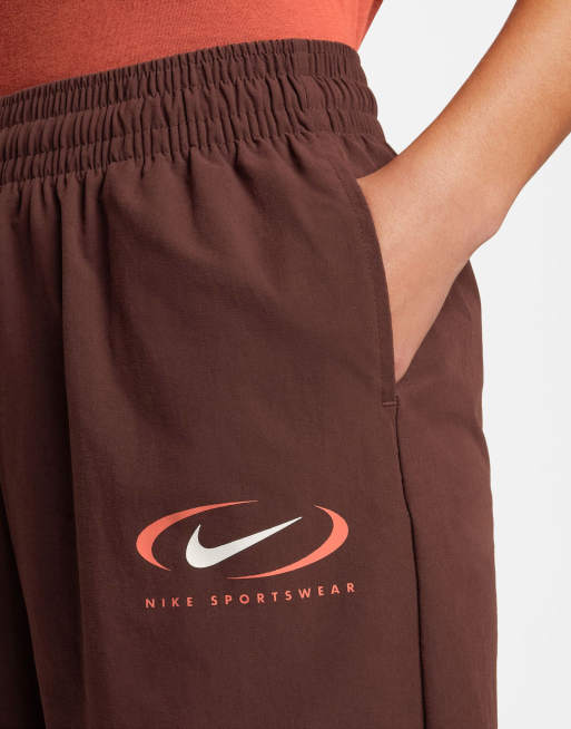 Nike Swoosh woven parachute sweatpants in earth brown