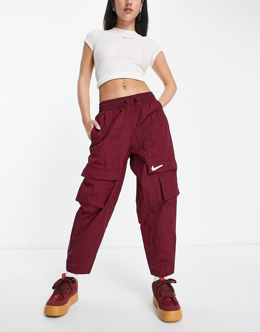 Nike Swoosh woven sweatpants in burgundy-Red