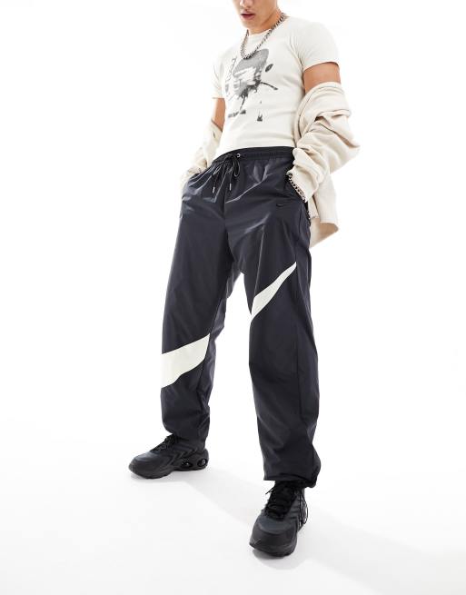 Shop Swoosh Men's Woven Trousers