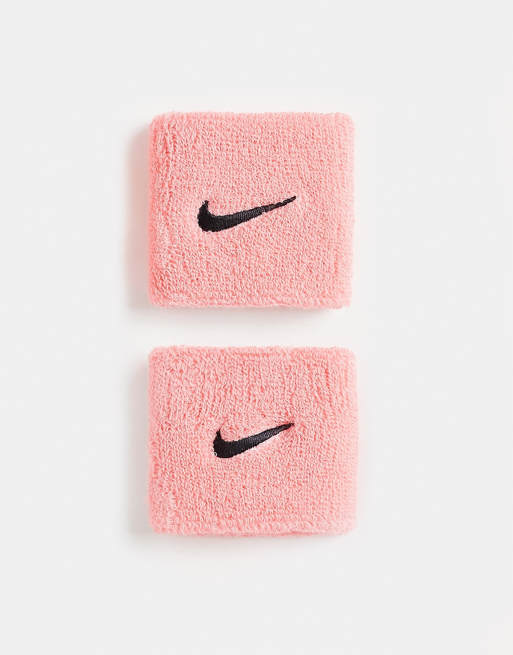 Nike Swoosh wristbands in pink