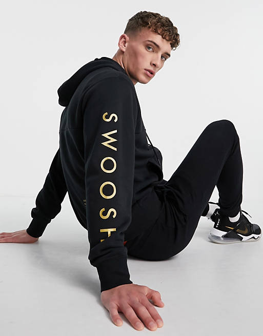 Nike Swoosh zip hoodie in black and gold