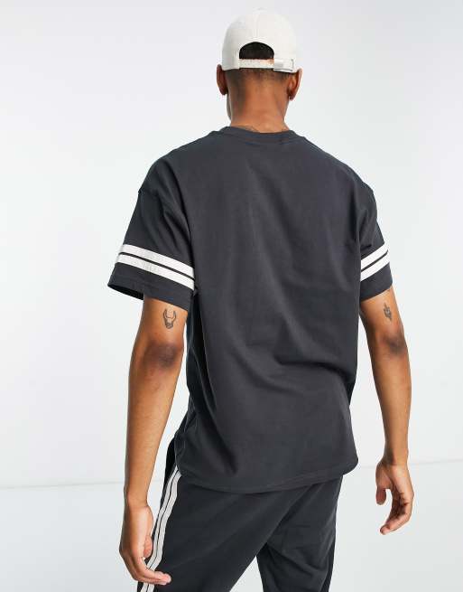 Nike - T-shirt à motif style universitaire rétro unisexe - Noir et blanc, 2 de 4