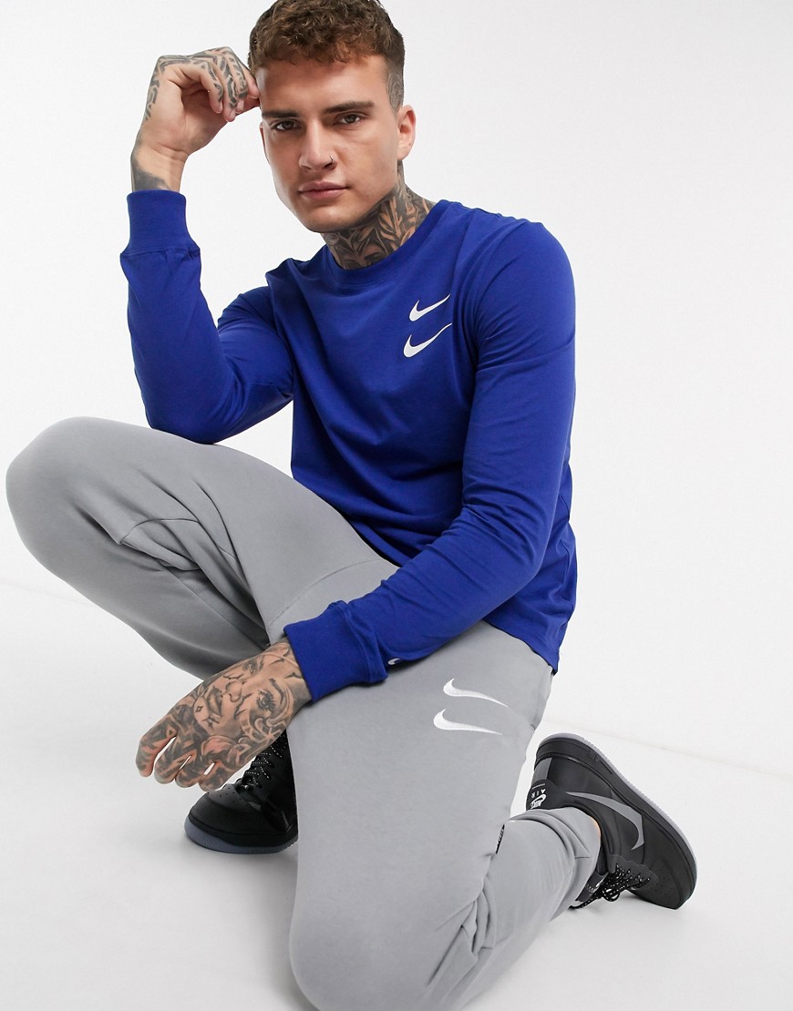 Nike - T-shirt blu a maniche lunghe con logo