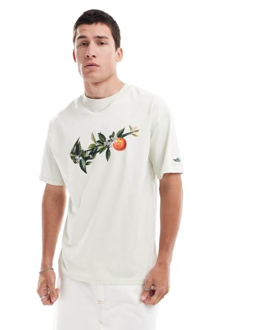 Nike - T-shirt unisex verde pallido con stampa di rametto e logo