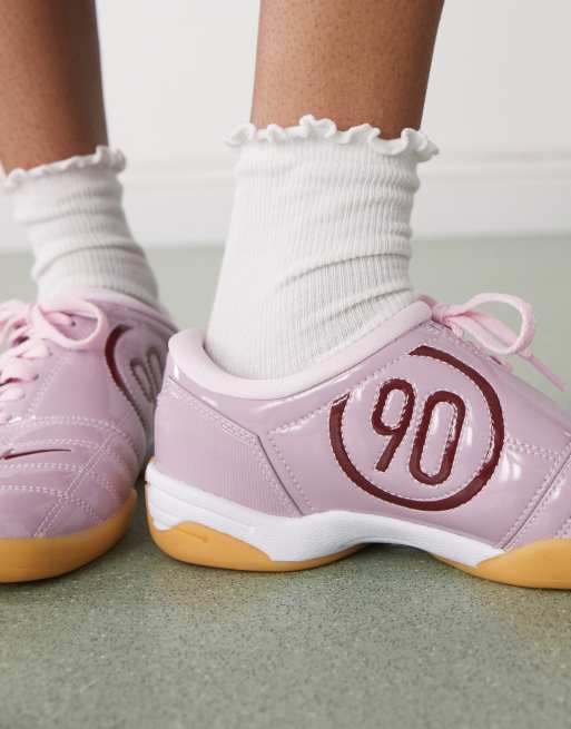 Nike T90 unisex trainers in pink metallic 