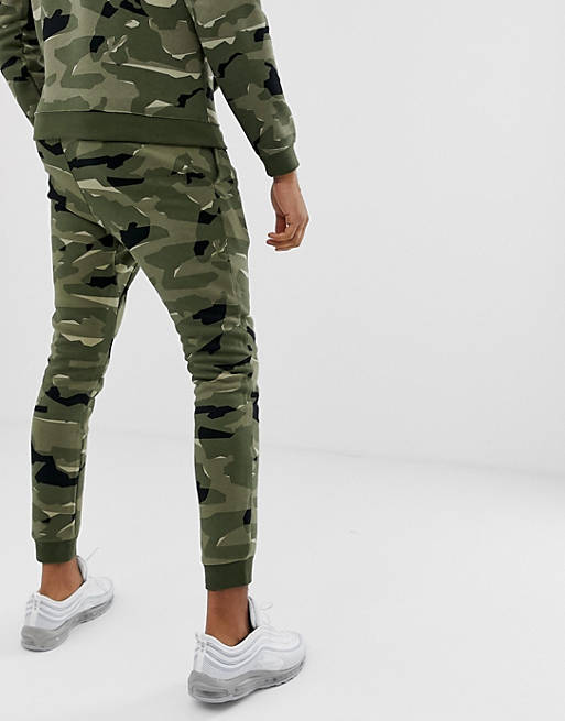 salade Triatleet Becks Nike - Tall - Club - Joggingbroek met camouflageprint in groen | ASOS