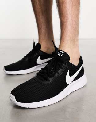 NIKE TANJUN SNEAKERS IN TRIPLE BLACK AND WHITE