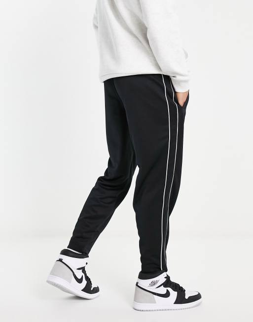 Nike joggers black 2025 with white stripe