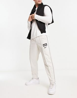 Nike tapered fit joggers in light bone - ASOS Price Checker