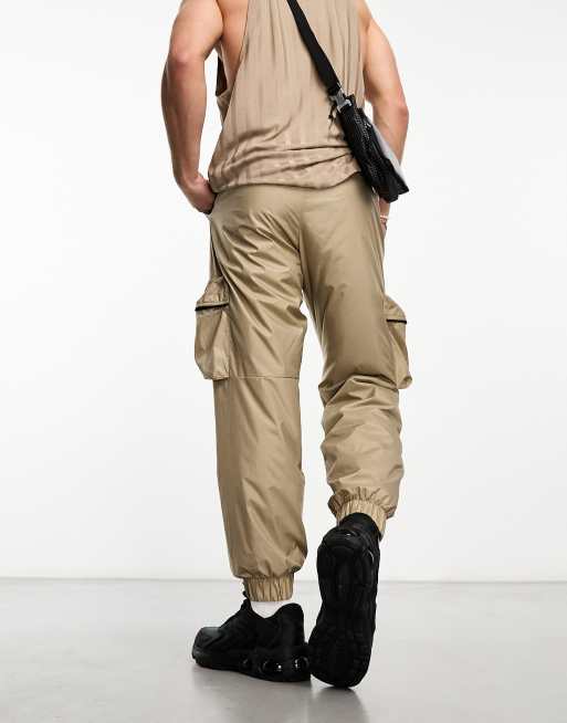 Nike Tech Essentials wind sweatpants in brown