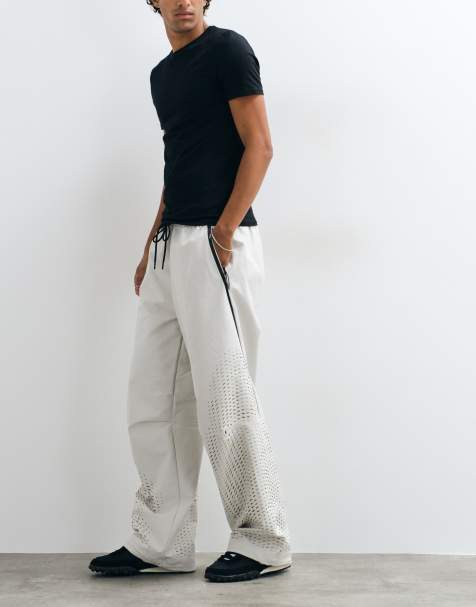Nike Tech Evolution wide leg trousers in beige 