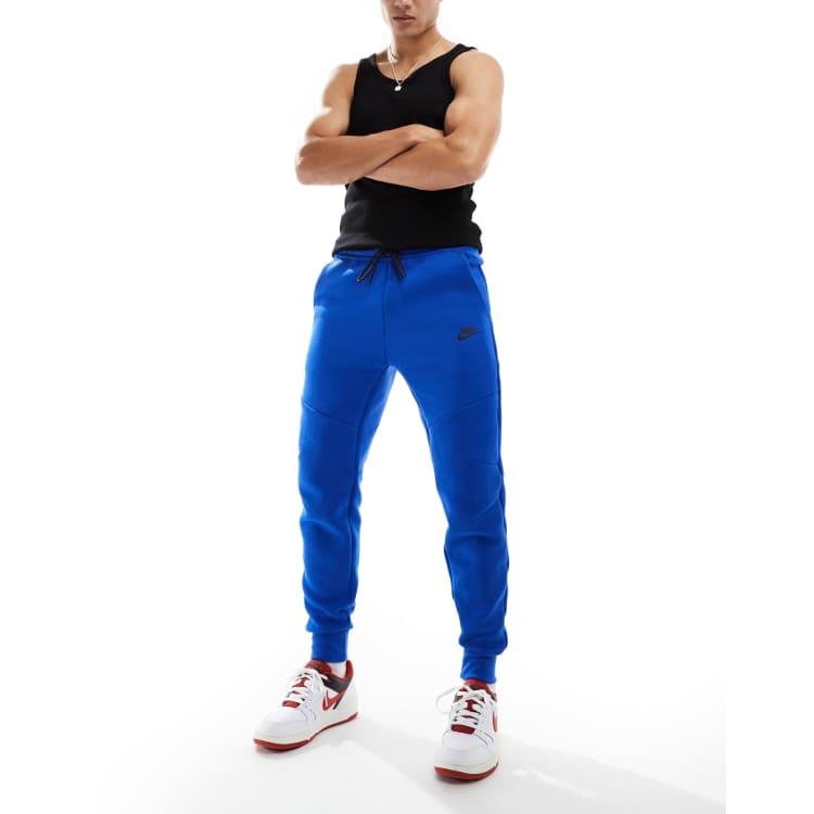 Nike Tech Fleece cuffed sweatpants in blue ASOS