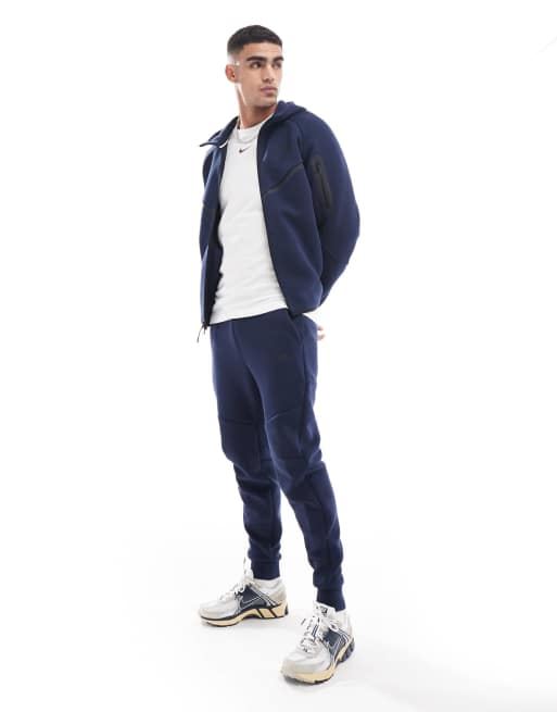 Nike Tech Fleece cuffed sweatpants in navy ASOS