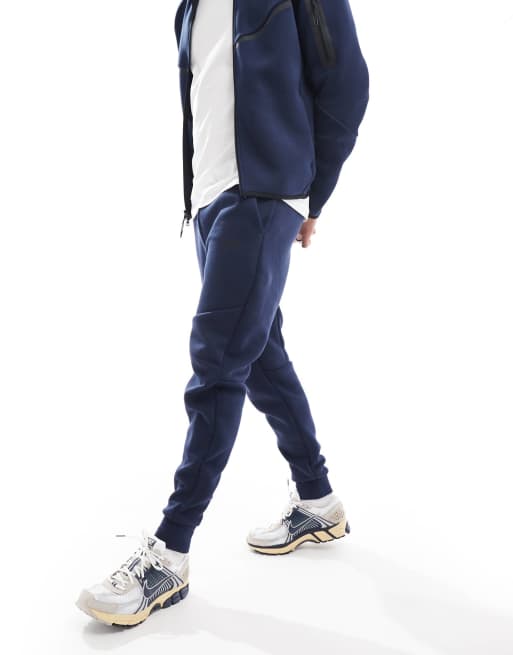 Nike Tech Fleece cuffed sweatpants in navy ASOS