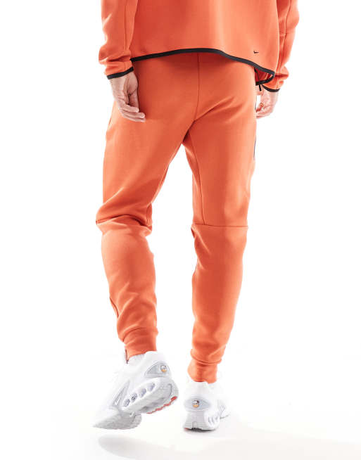 Orange sweatpants nike best sale