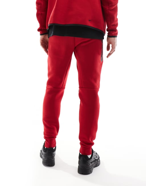 Nike Tech Fleece cuffed sweatpants in red ASOS
