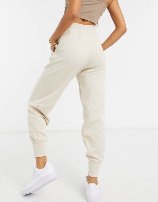 Nike tech fleece jogger in cream ASOS