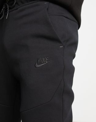 nike tech joggers black and white