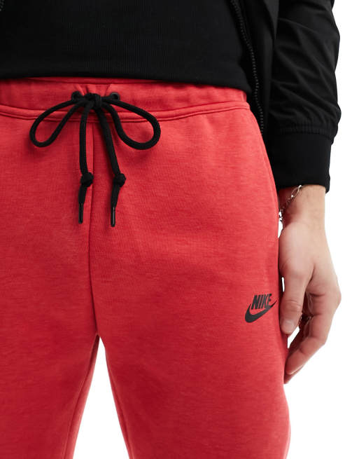 Nike Tech Fleece joggers in red ASOS