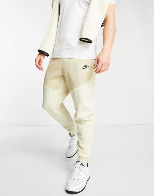 nike tech pants beige