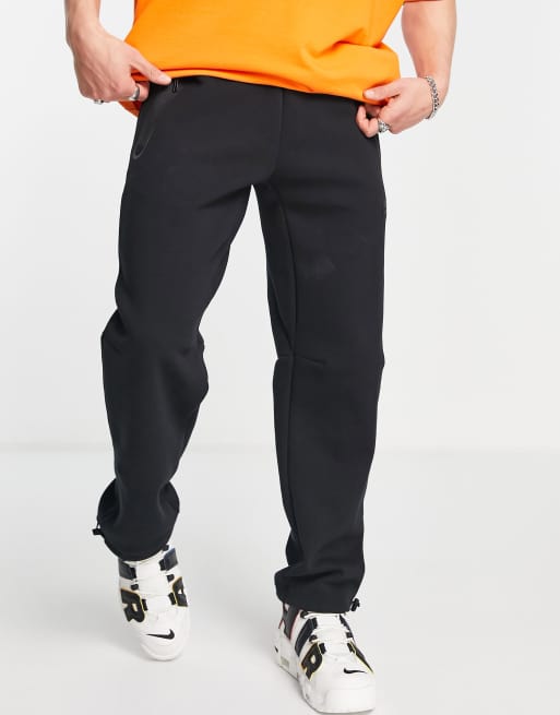 Nike tech fleece loose fit joggers with toggle in black | ASOS