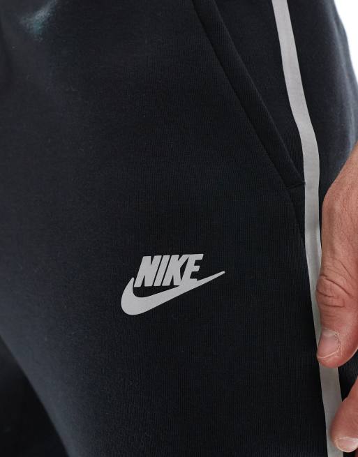 Nike Tech Fleece reflective joggers in black ASOS