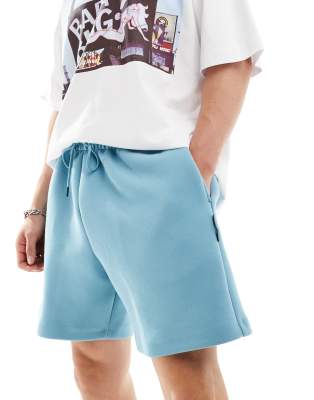 Nike Tech Fleece Reimagined oversized shorts in light blue