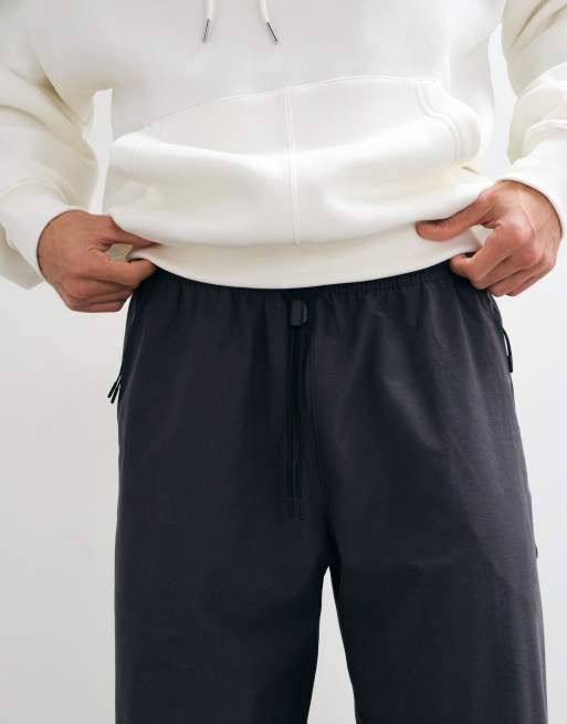 Nike Tech Fleece Shori joggingbukser med brede ben i mørkegrå, 3 af 5