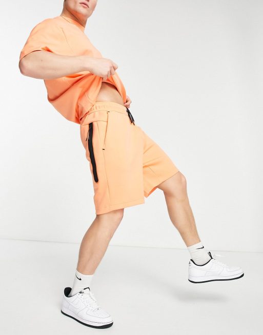 Orange nike cheap fleece shorts