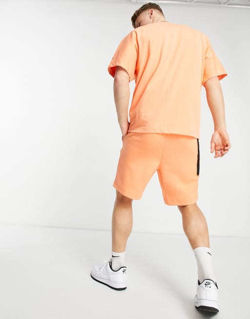 Orange nike tech outlet shorts